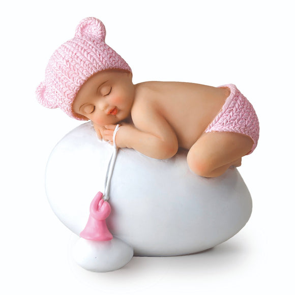 Y944.2 Figura niña bebé rosa durmiendo sobre huevo, 7,5x8cm.