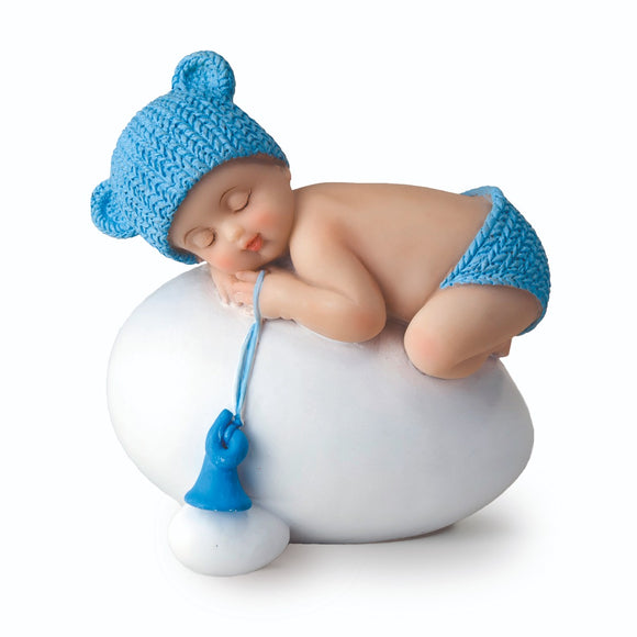 Y944.3 Figura niño bebé azul durmiendo sobre huevo,7,5x8cm.
